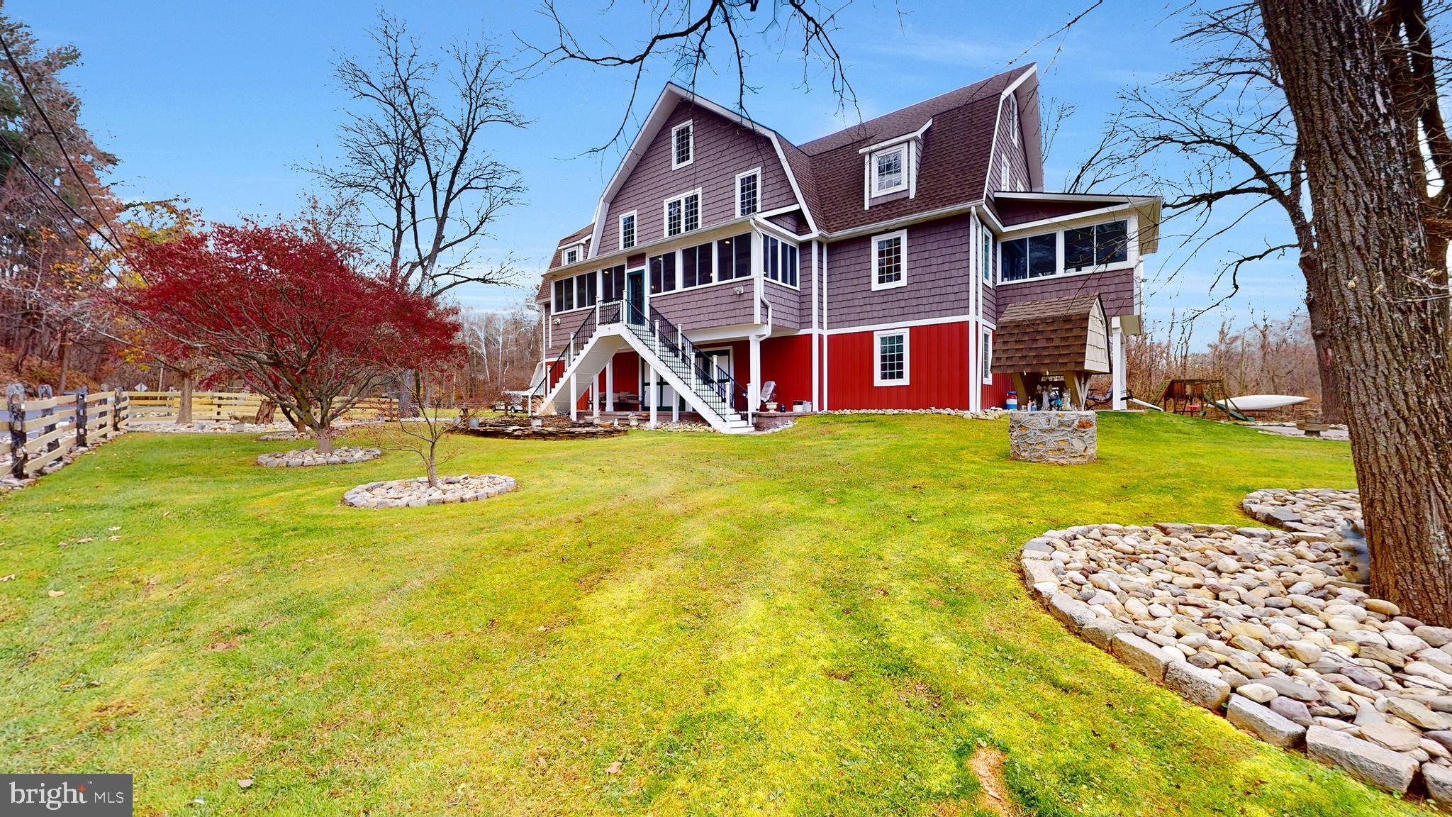 901 Crum Creek Road Springfield, PA 19064 - Photo 2 of 116 a view of a house with a big yard and large trees