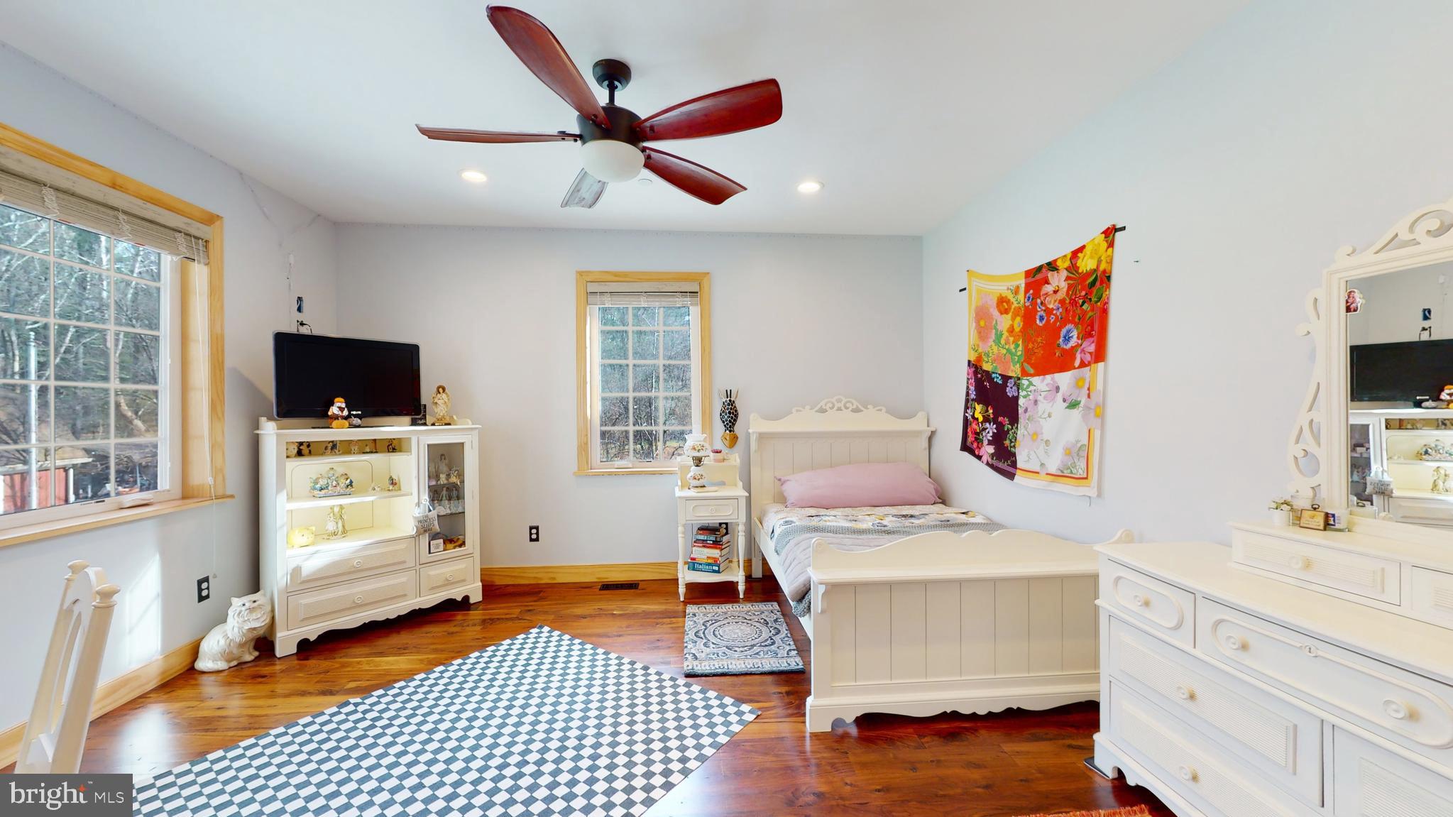 901 Crum Creek Road Springfield, PA 19064 - Photo 24 of 116 a bedroom with furniture and a flat screen tv