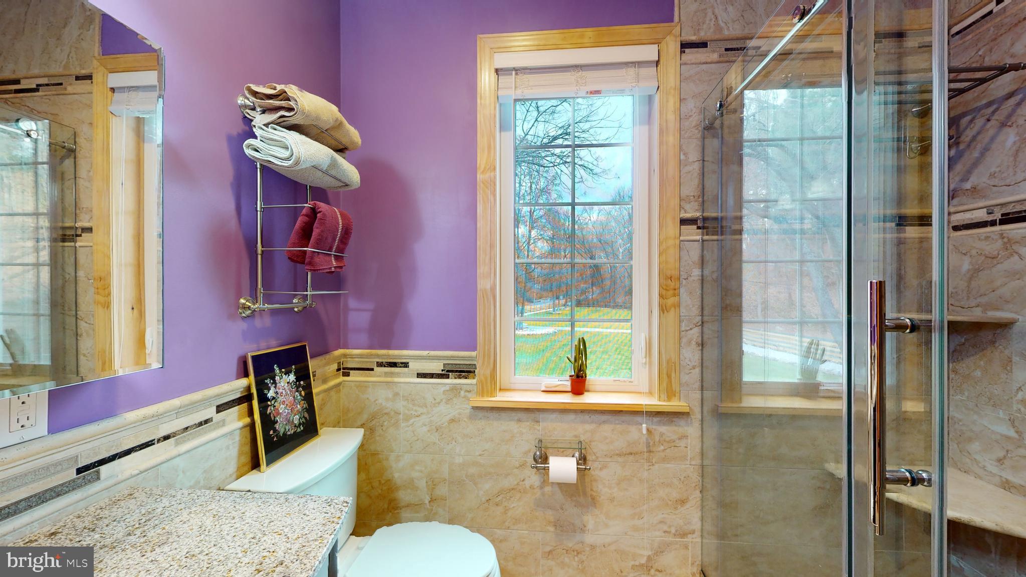 901 Crum Creek Road Springfield, PA 19064 - Photo 25 of 116 a bathroom with a granite countertop shower a mirror and a sink