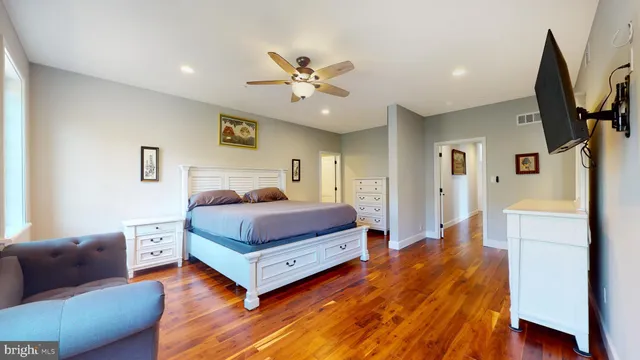 a view of hallway with livingroom and stairs