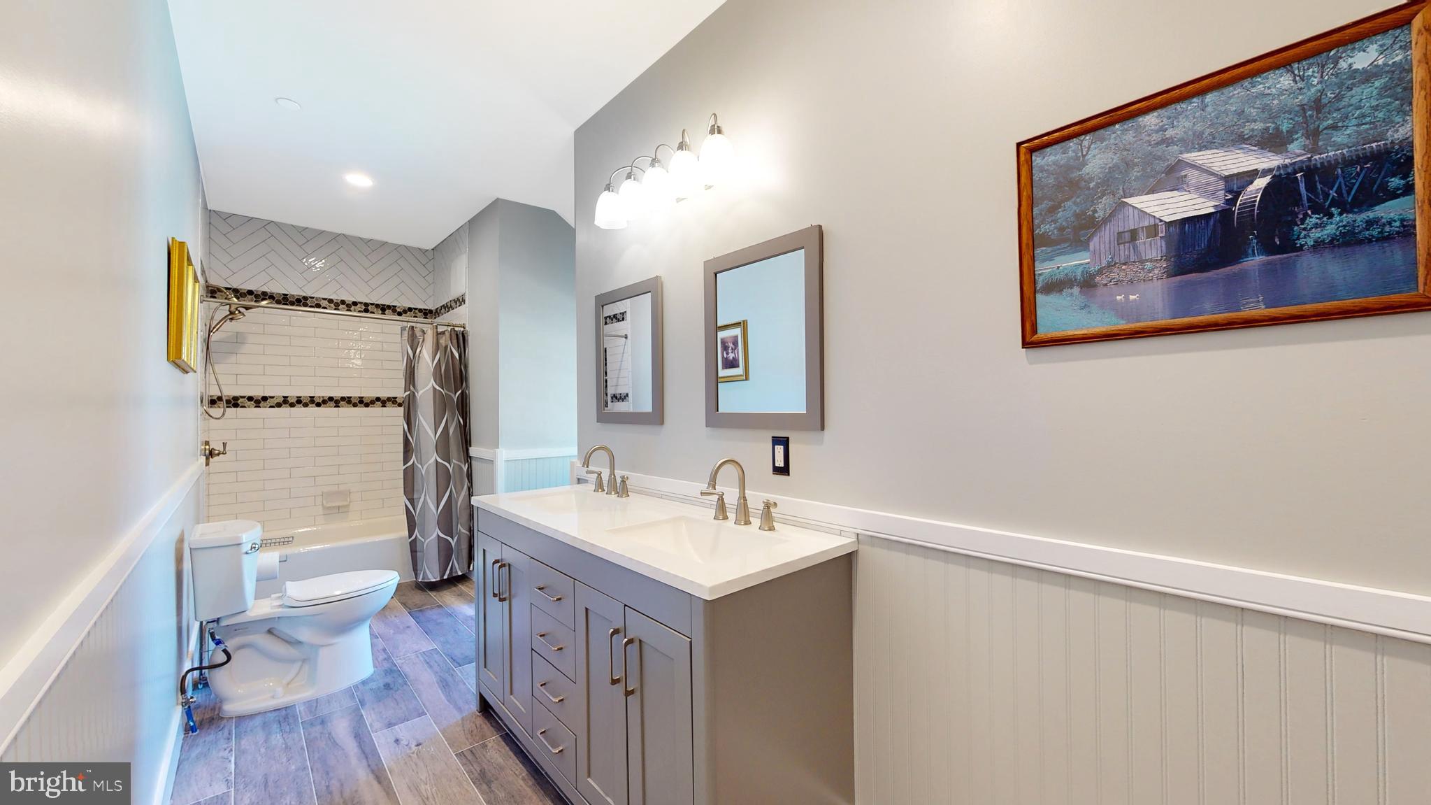 901 Crum Creek Road Springfield, PA 19064 - Photo 33 of 116 a bathroom with a sink and a mirror