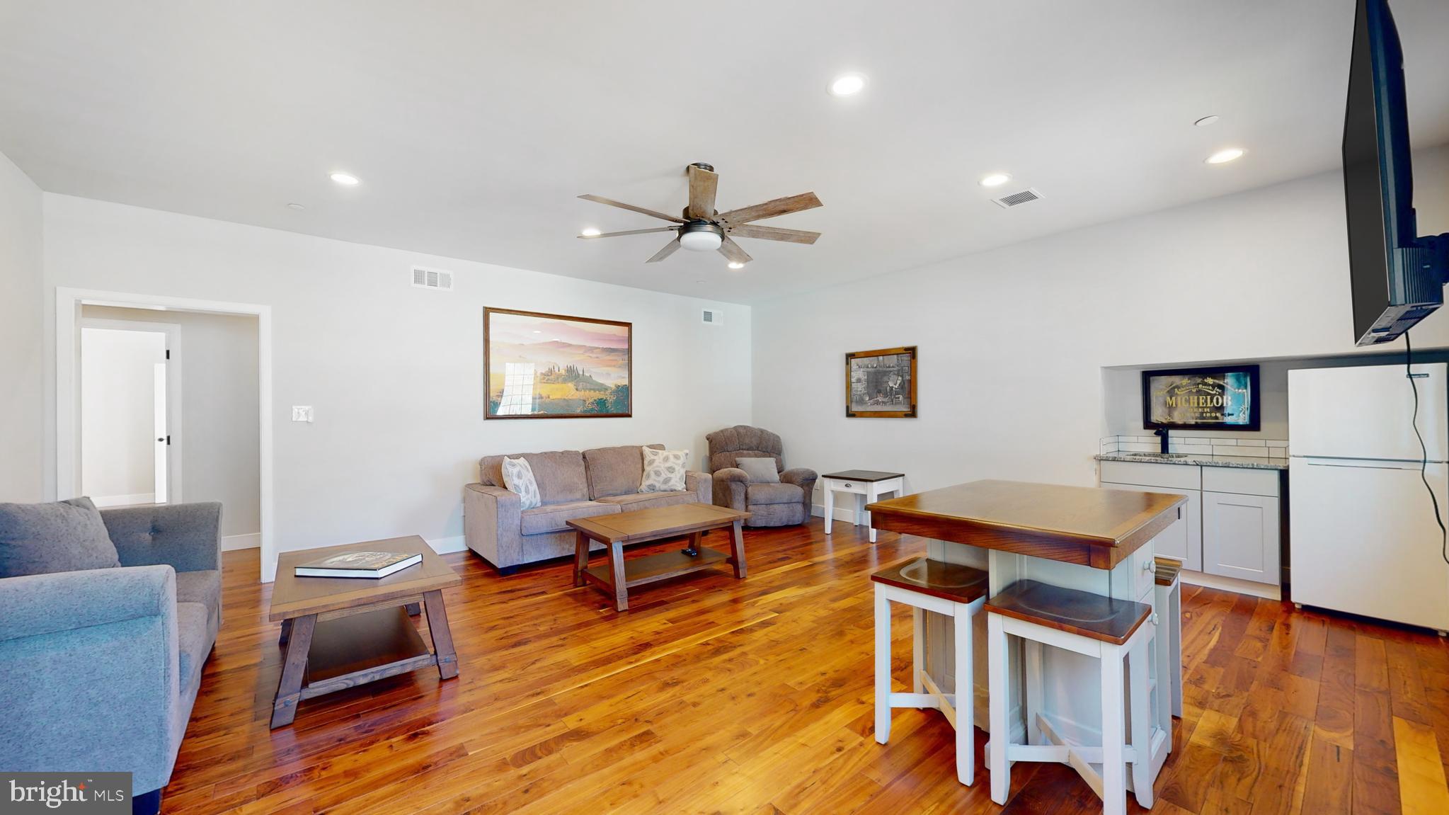 901 Crum Creek Road Springfield, PA 19064 - Photo 39 of 116 a living room with furniture and wooden floor