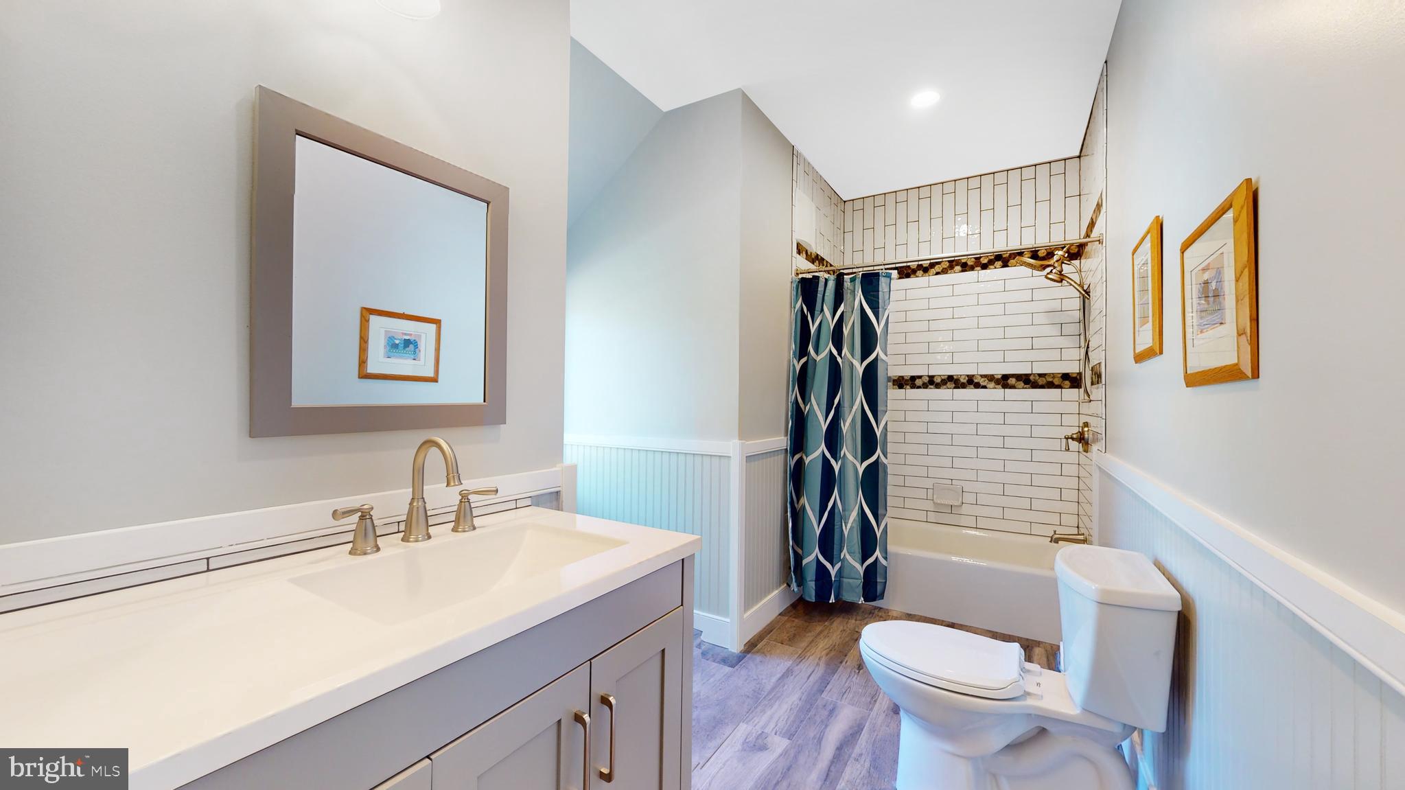 901 Crum Creek Road Springfield, PA 19064 - Photo 41 of 116 a bathroom with a sink toilet tub and shower