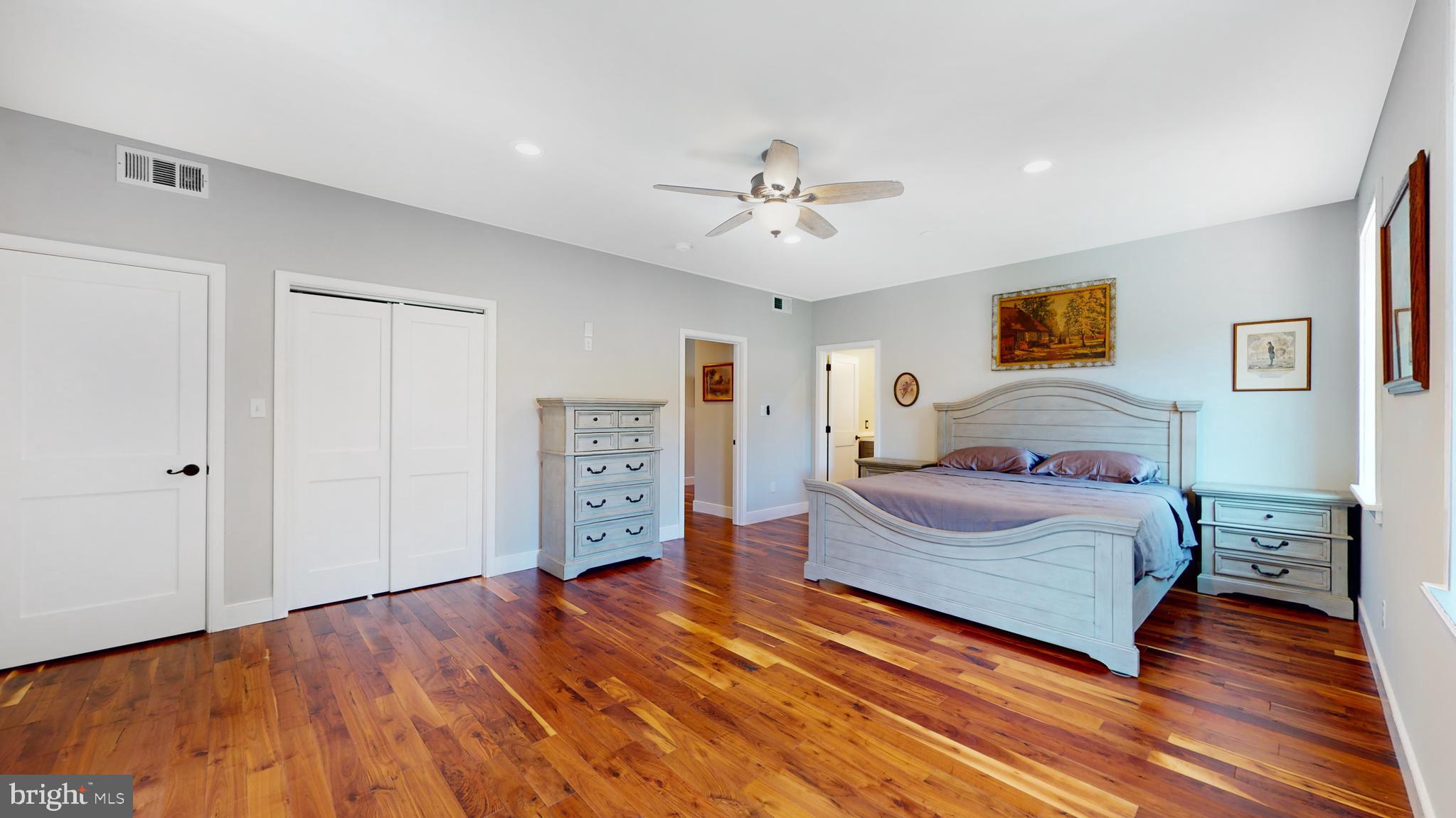 901 Crum Creek Road Springfield, PA 19064 - Photo 44 of 116 a bedroom with a bed and wooden floor