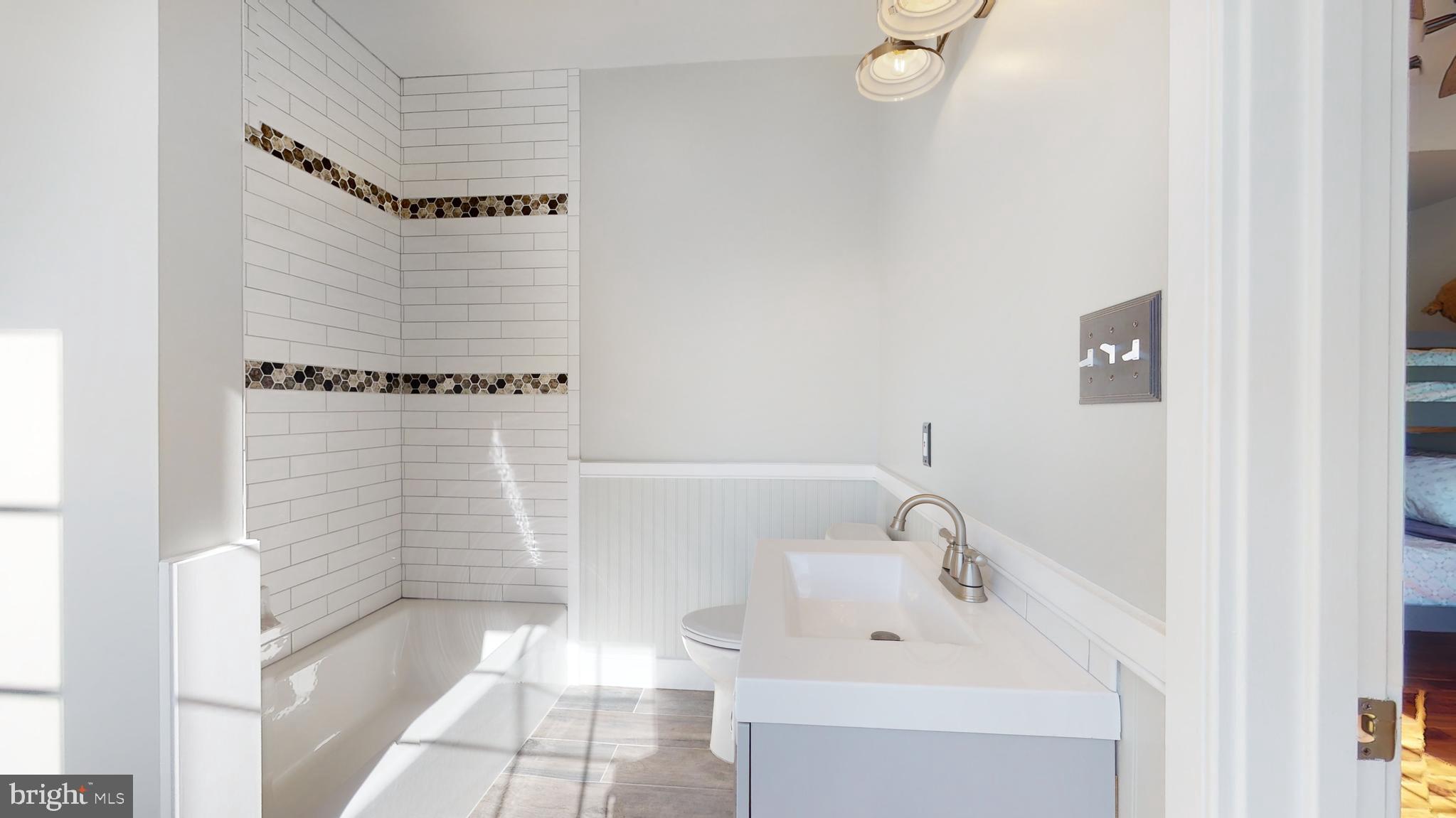 901 Crum Creek Road Springfield, PA 19064 - Photo 46 of 116 a bathroom with a sink a toilet and shower