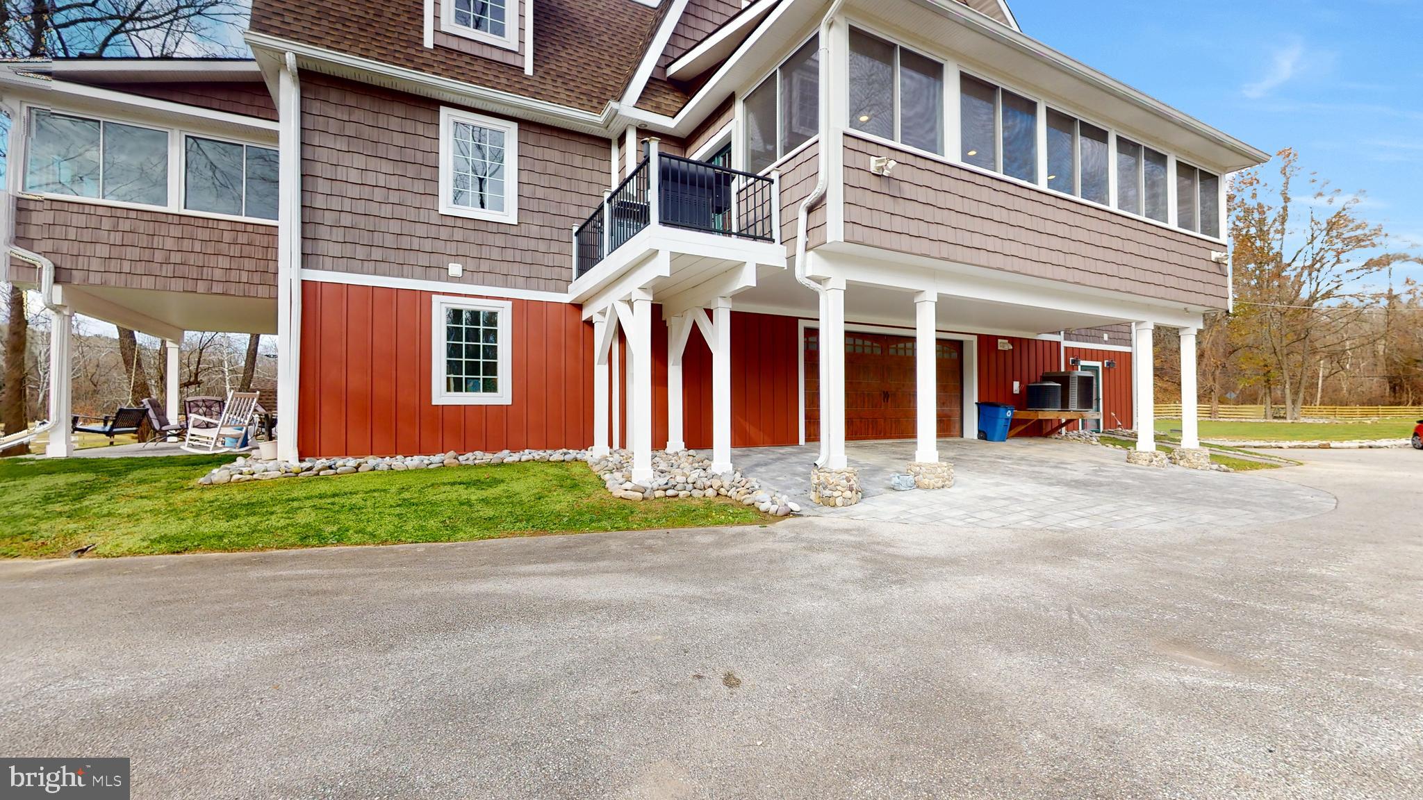 901 Crum Creek Road Springfield, PA 19064 - Photo 5 of 116 a front view of a house with a yard and garage