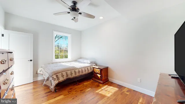 a view of building with yard and trees in the background