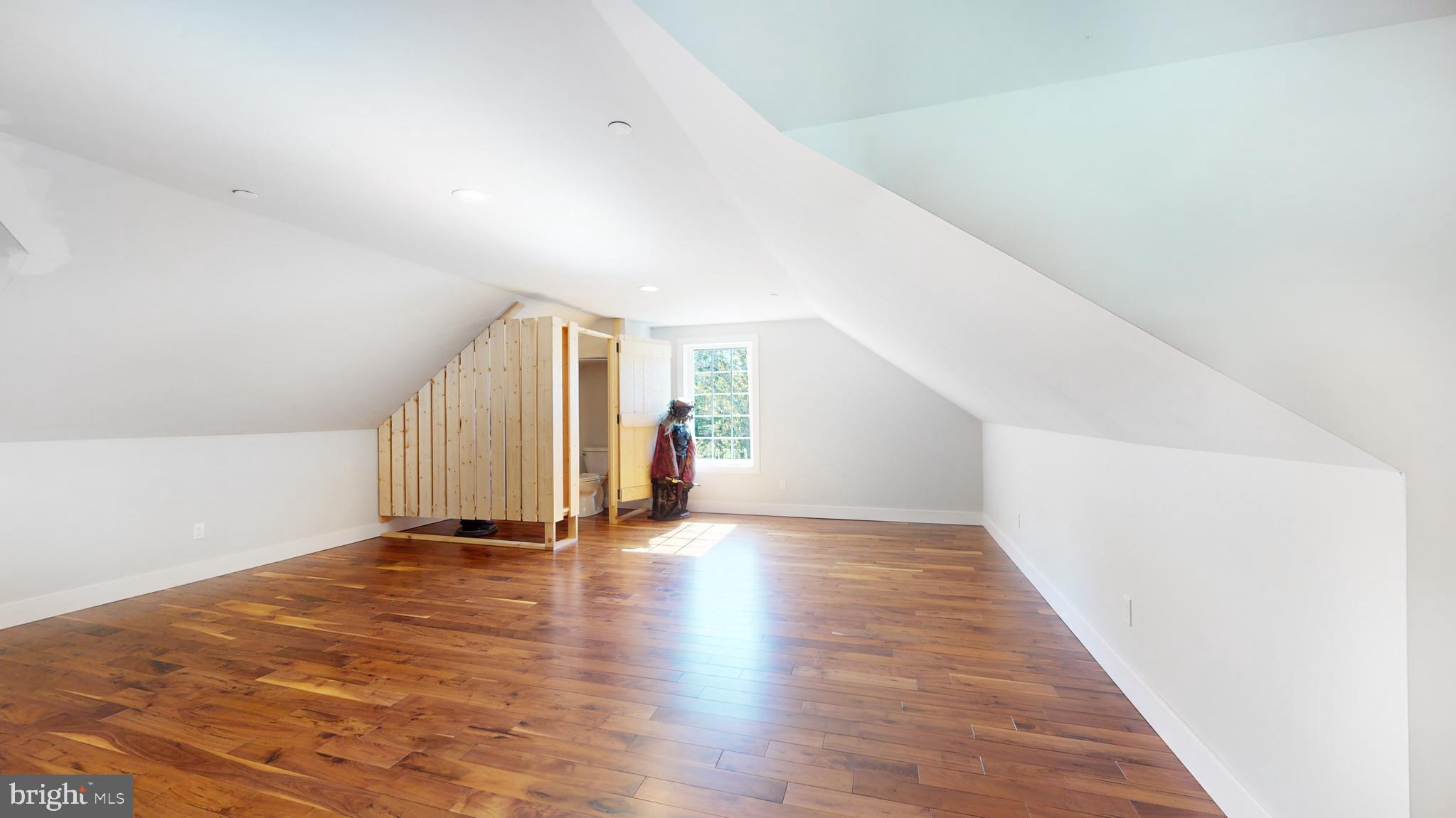 901 Crum Creek Road Springfield, PA 19064 - Photo 50 of 116 a view of an empty room with wooden floor