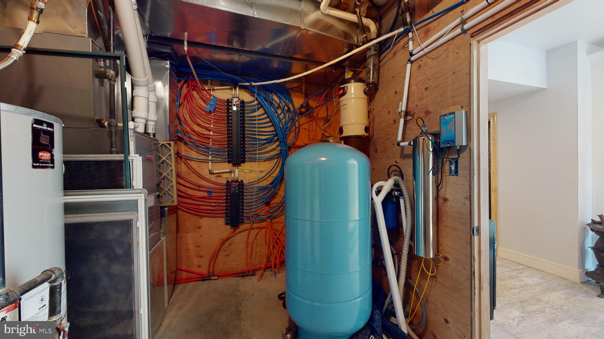 901 Crum Creek Road Springfield, PA 19064 - Photo 58 of 116 a view of walk in closet with clothes and shoes