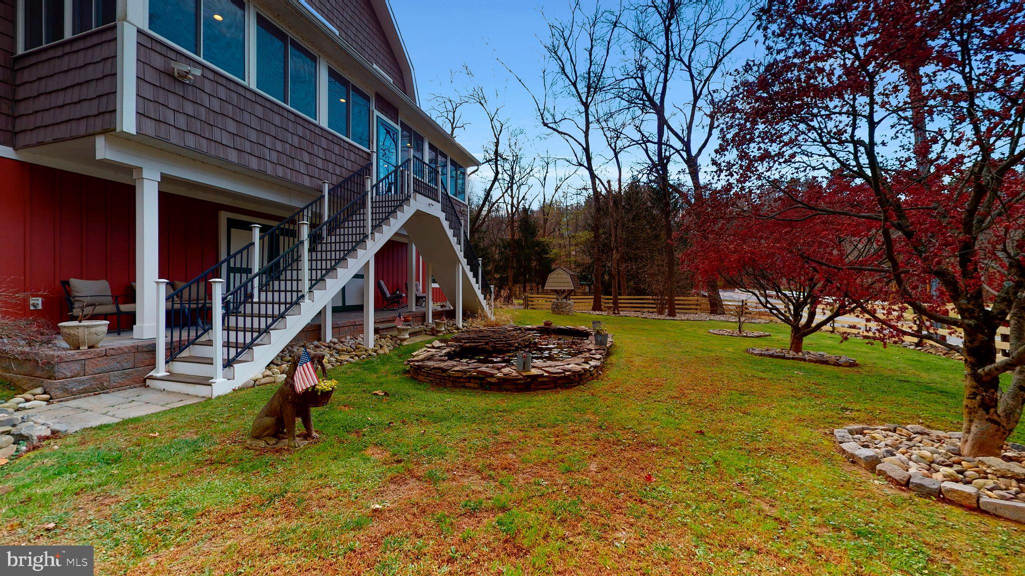 901 Crum Creek Road Springfield, PA 19064 - Photo 81 of 116 a view of a backyard with a table and chairs