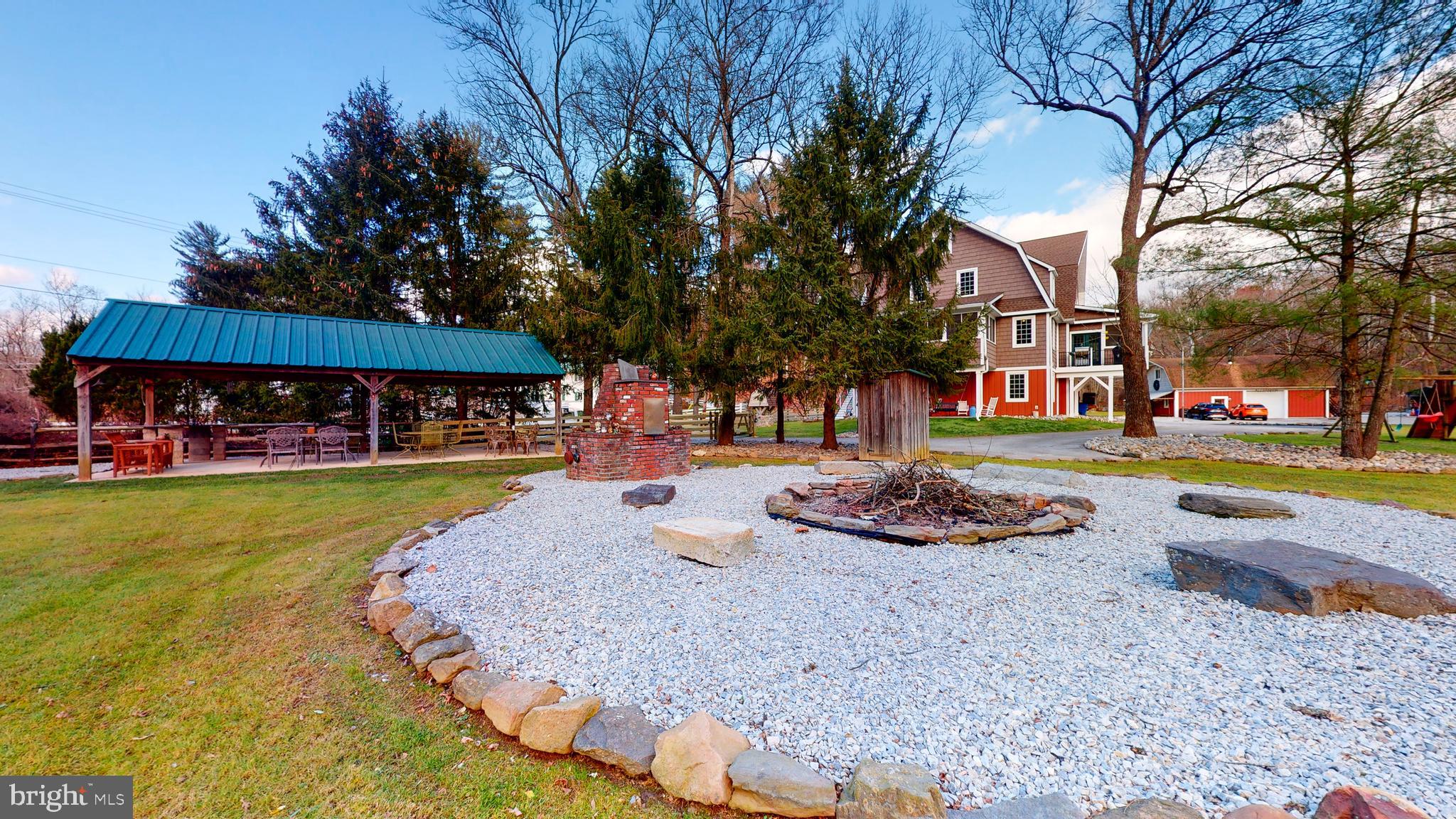 901 Crum Creek Road Springfield, PA 19064 - Photo 86 of 116 a front view of a house with garden and swimming pool