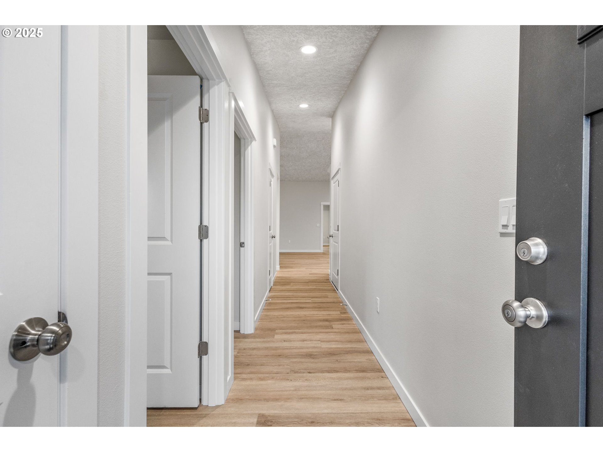 3627 Green River Road Sweet Home, OR 97386 - Photo 27 of 32 a view of a hallway with wooden floor