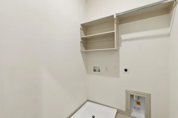 an empty room with a ceiling fan and closet area