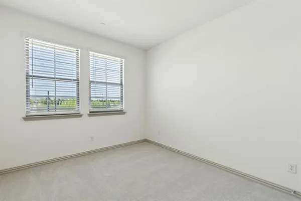 a front view of a house with garage