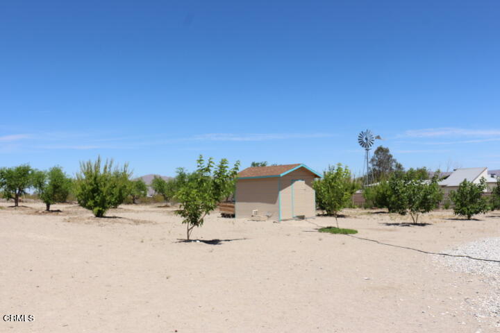 9522 Mesa Road Lucerne Valley, CA 92356 - Photo 3 of 3 a view of a road with a building in the background