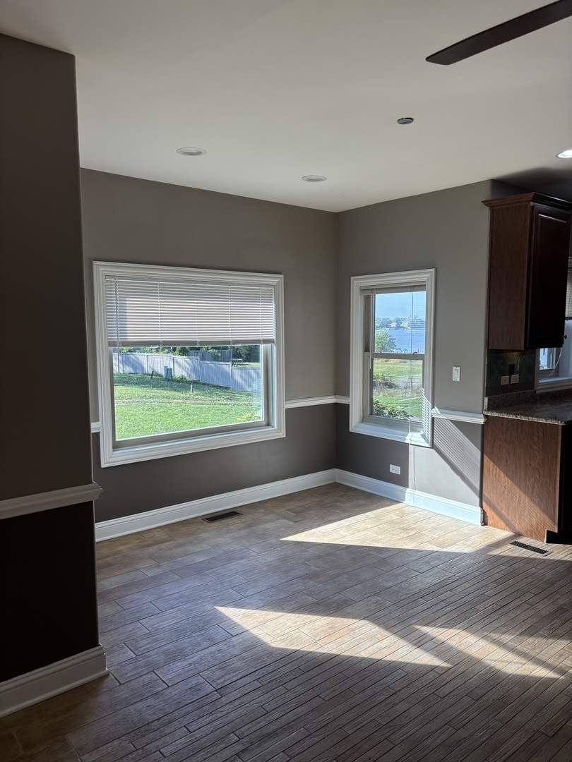 40 Mischa Court, Unit 100 Lake Zurich, IL 60047 - Photo 12 of 36 a view of kitchen with furniture and flat screen tv
