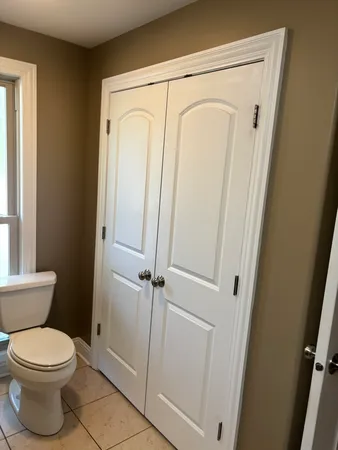 a view of hallway with wooden floor
