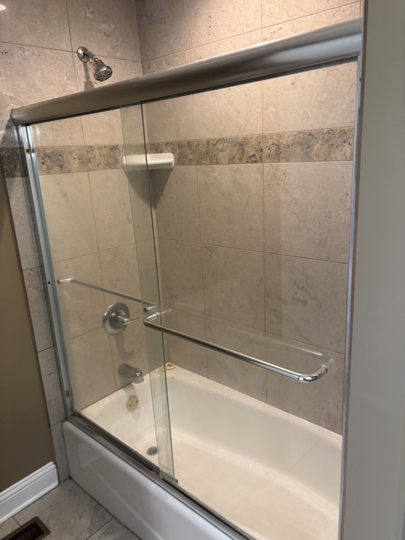 40 Mischa Court, Unit 100 Lake Zurich, IL 60047 - Photo 22 of 36 a bathroom with a shower and a sink