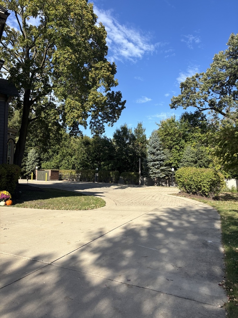 40 Mischa Court, Unit 100 Lake Zurich, IL 60047 - Photo 36 of 36 a view of a swimming pool with an outdoor space and seating area