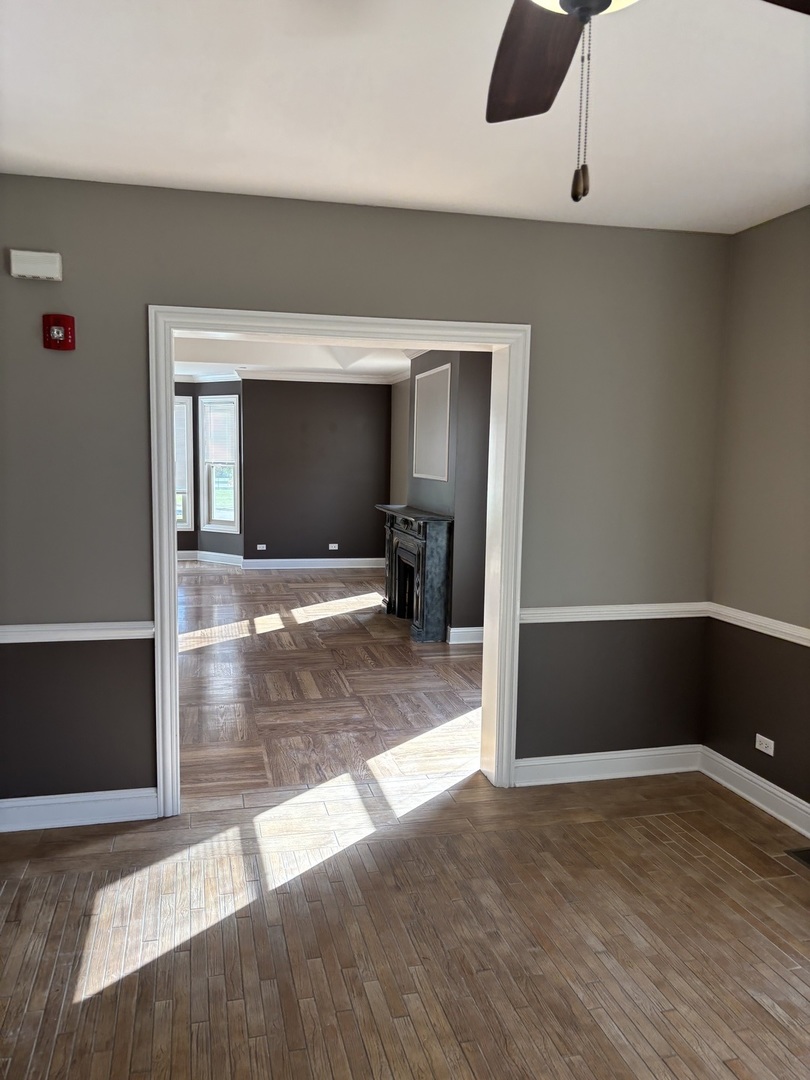 40 Mischa Court, Unit 100 Lake Zurich, IL 60047 - Photo 6 of 36 a view of a livingroom with wooden floor