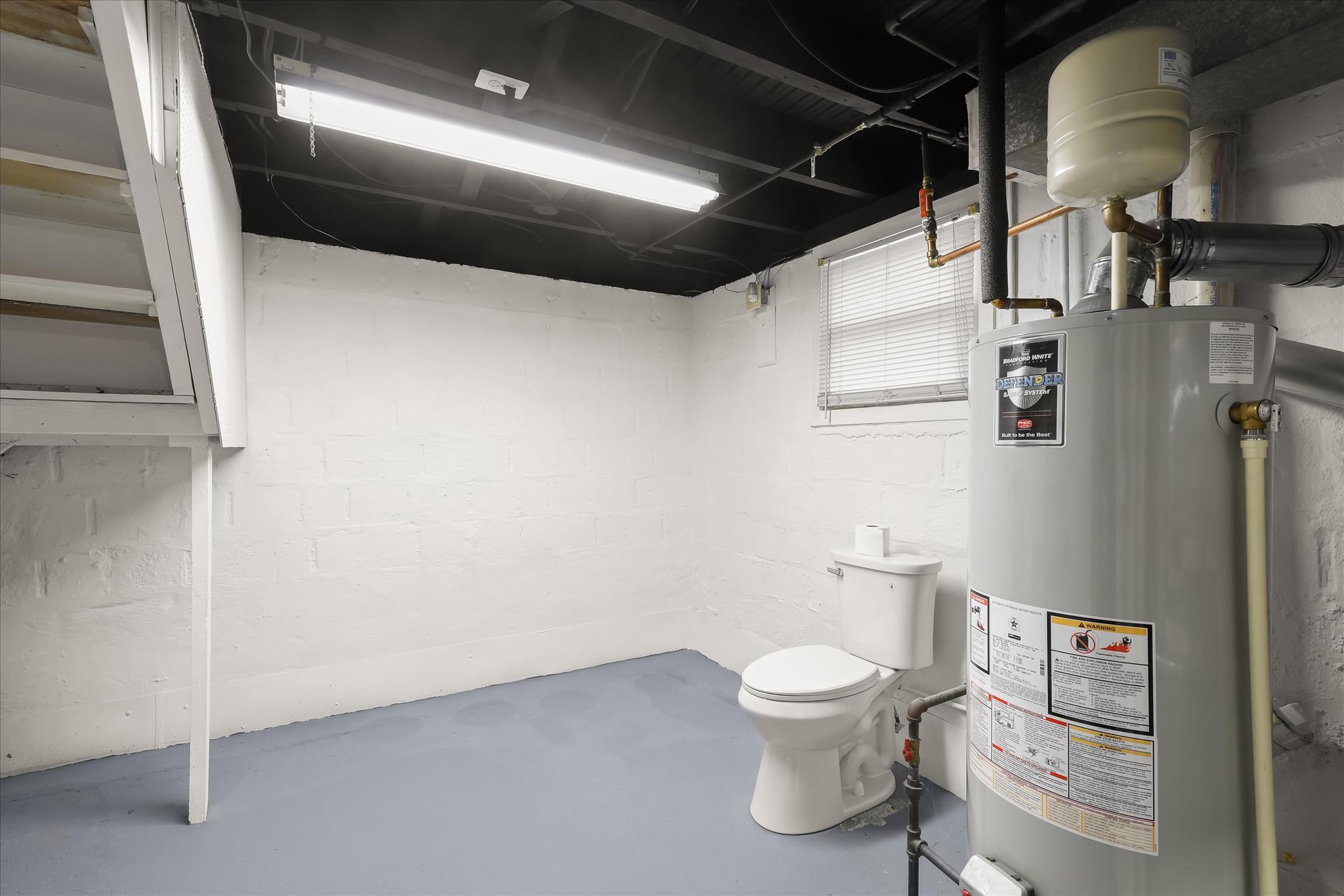 1218 Rustic Avenue Rosedale, MD 21237 - Photo 23 of 34 a white toilet sitting next to a white cabinet