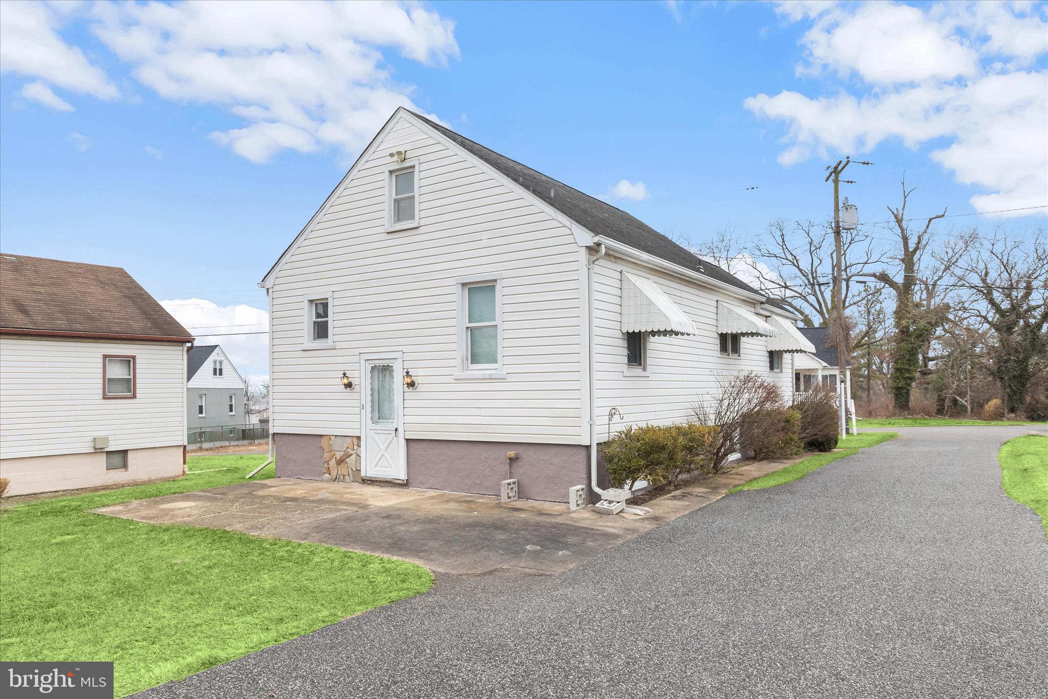 1218 Rustic Avenue Rosedale, MD 21237 - Photo 25 of 34 a view of a house with backyard and trees