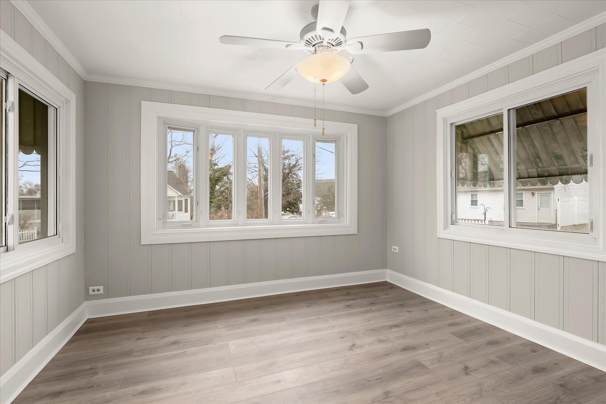 1218 Rustic Avenue Rosedale, MD 21237 - Photo 5 of 34 a view of an empty room with wooden floor and a window