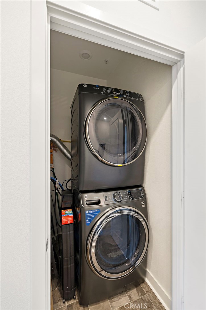 61 Wheelbarrow Road Rancho Mission Viejo, CA 92694 - Photo 23 of 74 a utility room with dryer and washer