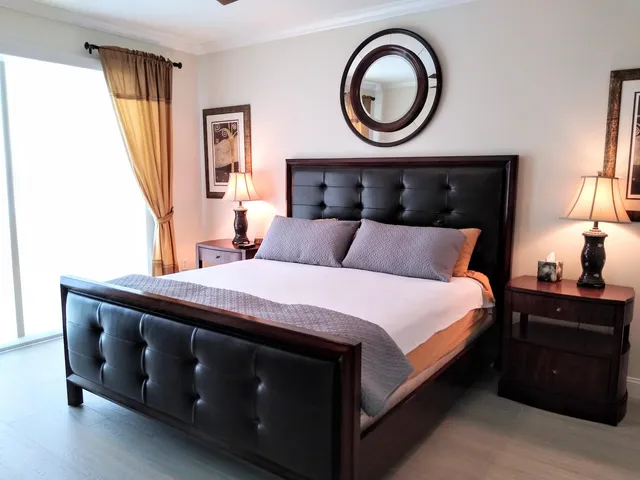 a bedroom with a bed and a dresser