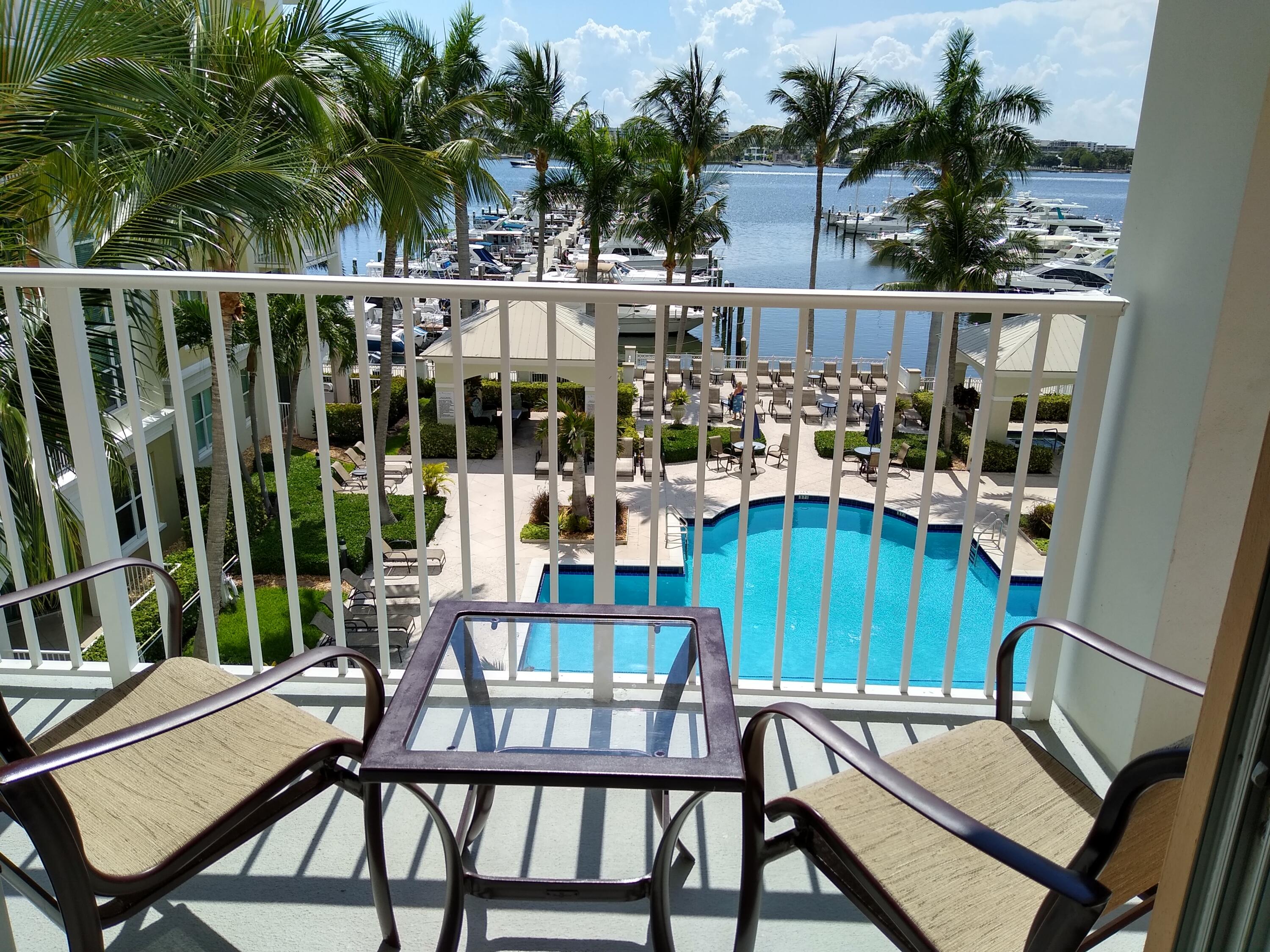806 East Windward Way, Unit 410 Lantana, FL 33462 - Photo 2 of 33 a view of a chairs and table in patio
