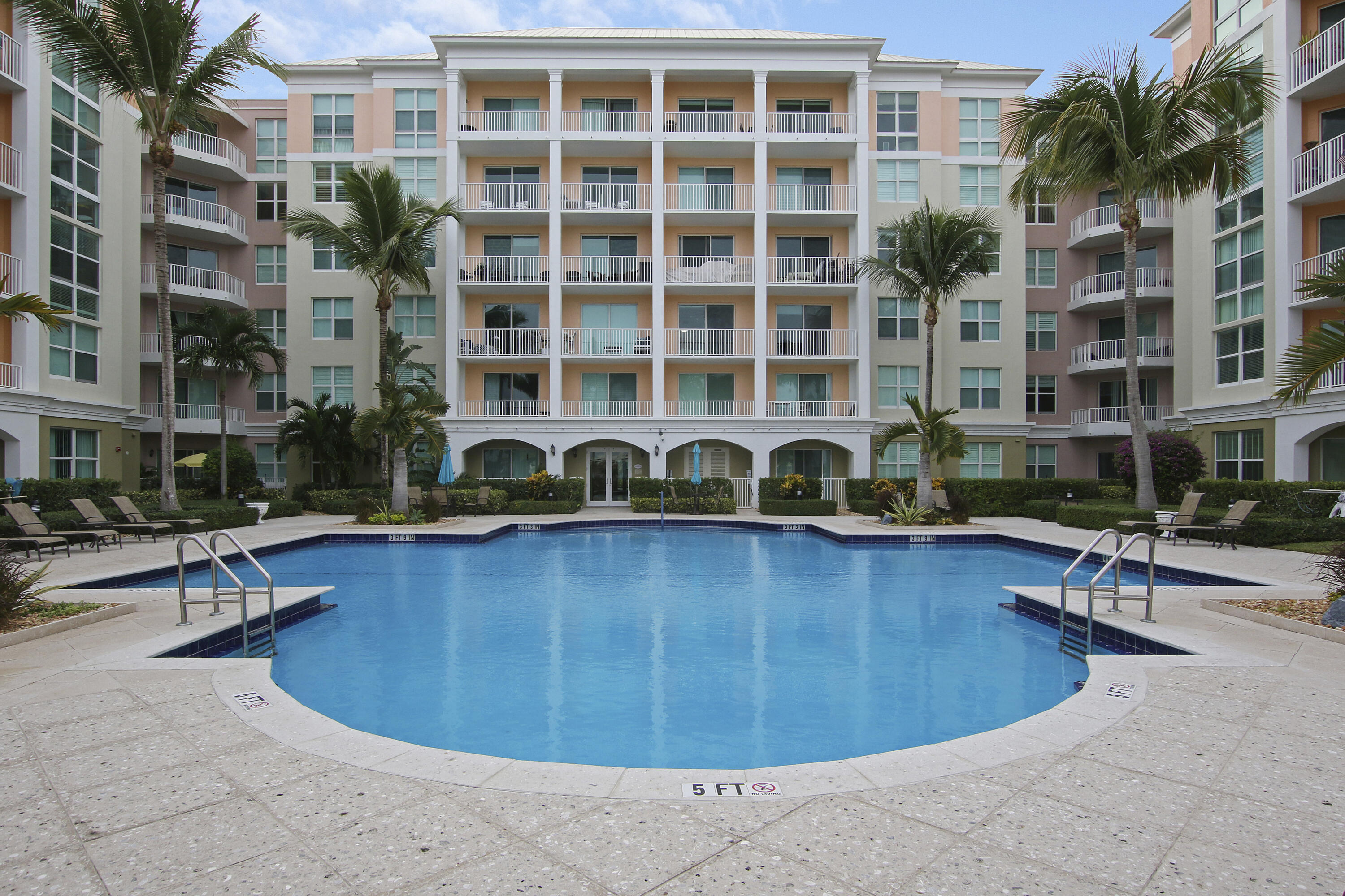 806 East Windward Way, Unit 410 Lantana, FL 33462 - Photo 26 of 33 a view of a swimming pool with outdoor seating