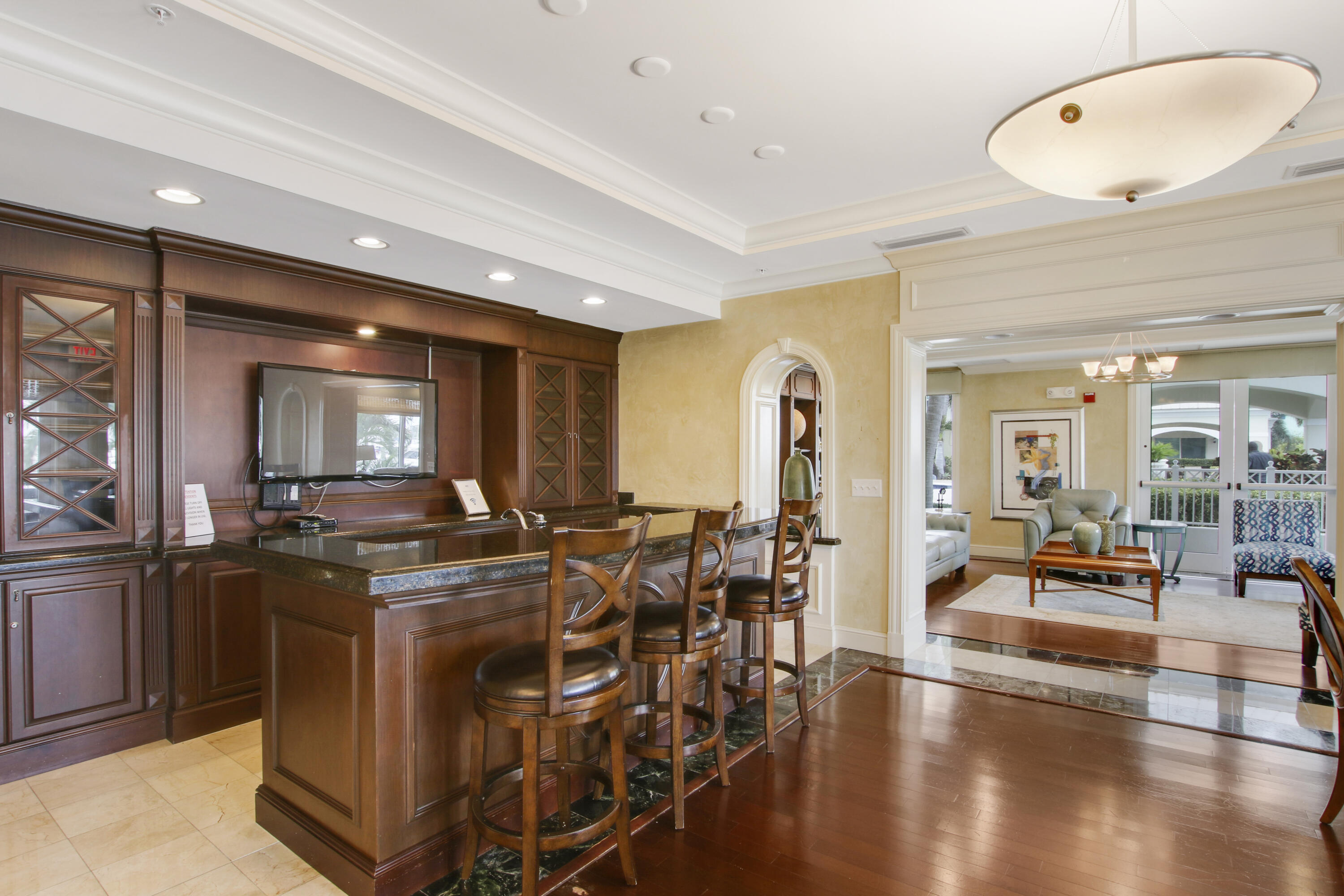806 East Windward Way, Unit 410 Lantana, FL 33462 - Photo 30 of 33 a view of a livingroom with furniture and wooden floor