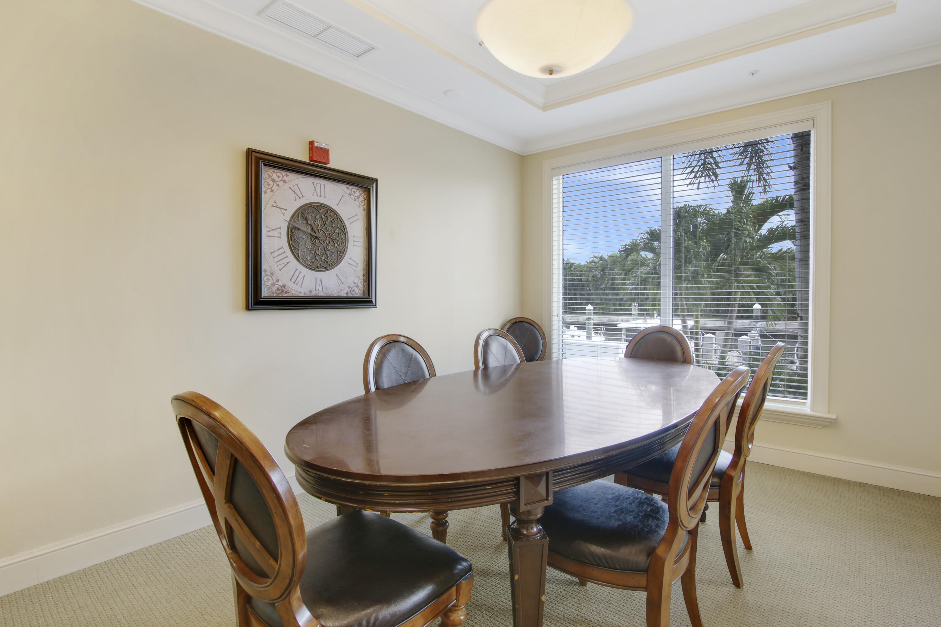 806 East Windward Way, Unit 410 Lantana, FL 33462 - Photo 32 of 33 a table and chairs in a room