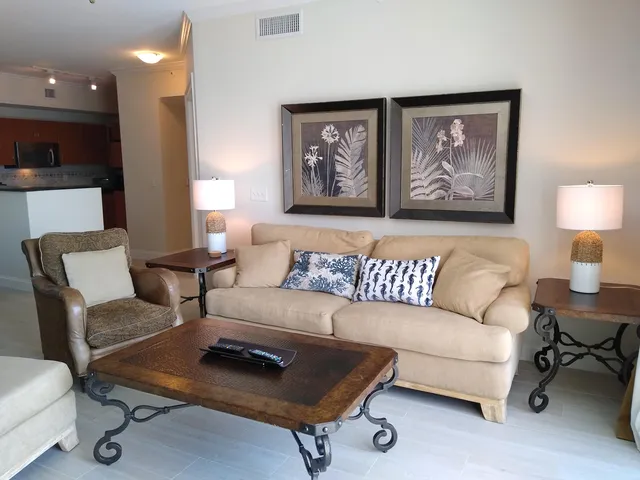 a living room with furniture and a night stand