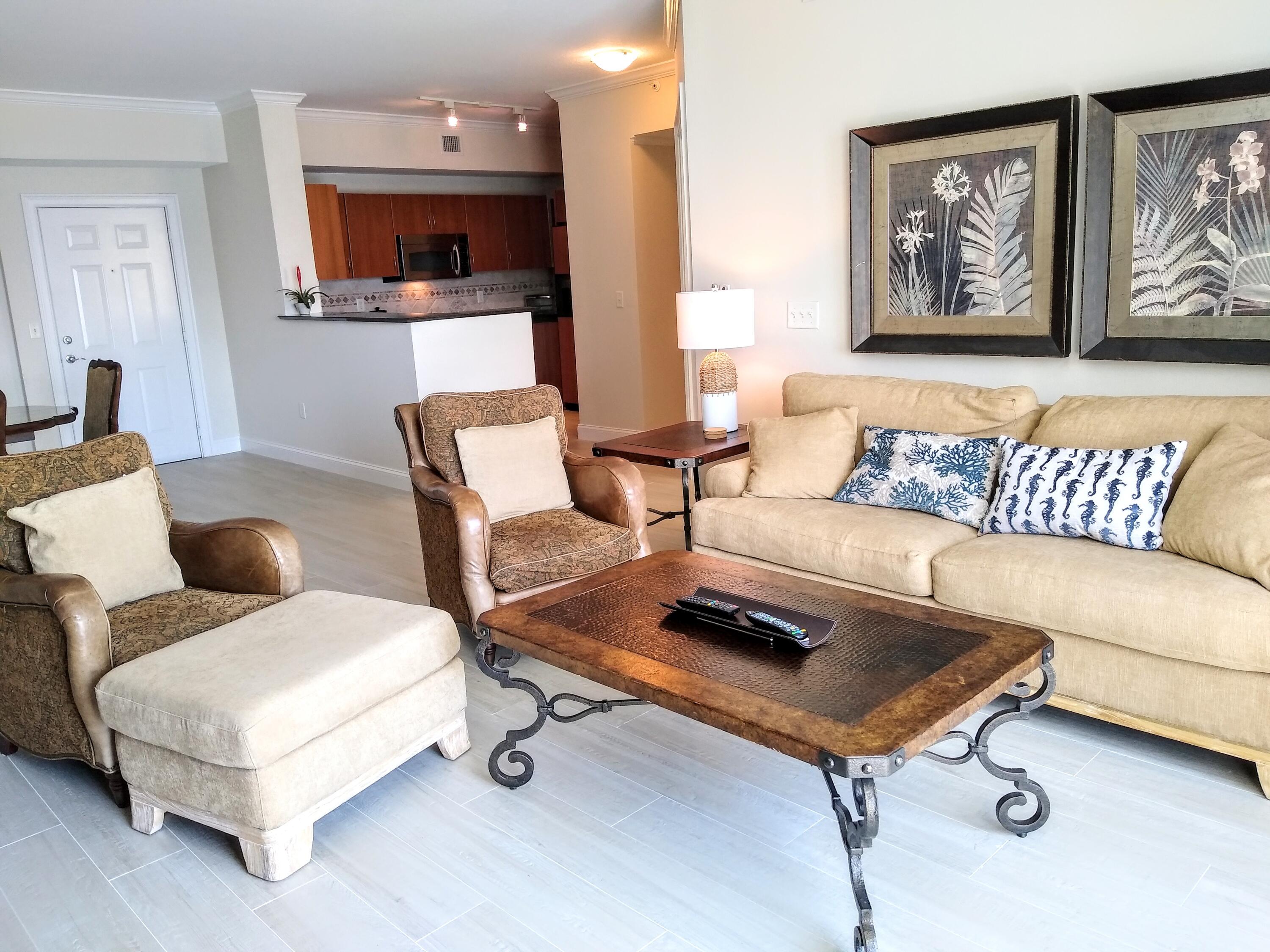 806 East Windward Way, Unit 410 Lantana, FL 33462 - Photo 5 of 33 a living room with furniture and a couch