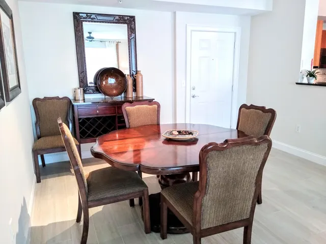 a dining room with furniture and window