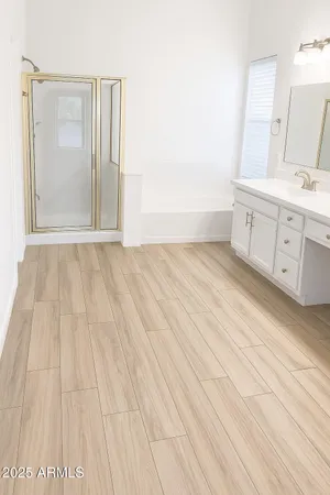 a view of a room with wooden floor