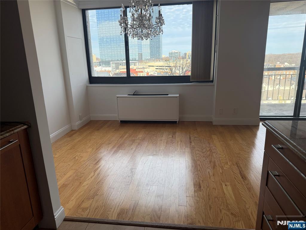 200 Old Palisade Road, Unit 7J Fort Lee, NJ 07024 - Photo 12 of 20 a view of a room with wooden floor and a window