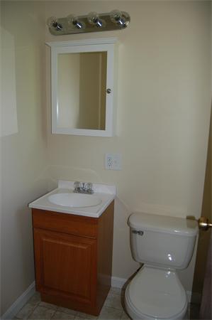 8 Ipswich Road Topsfield, MA 01983 - Photo 11 of 14 a bathroom with a toilet sink and mirror