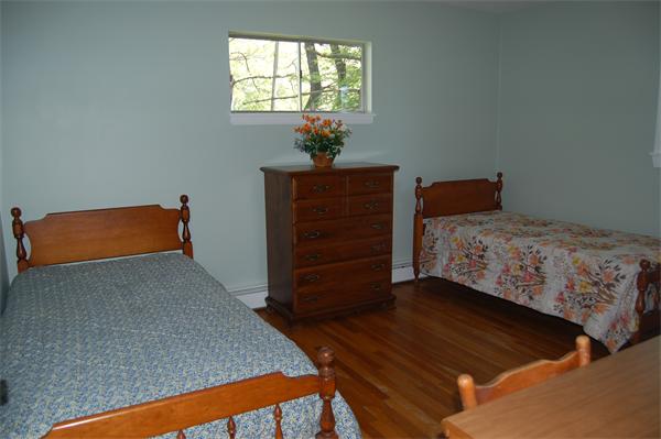 8 Ipswich Road Topsfield, MA 01983 - Photo 12 of 14 a bedroom with a bed and window