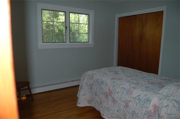 8 Ipswich Road Topsfield, MA 01983 - Photo 13 of 14 a bed sitting in a bedroom next to a window