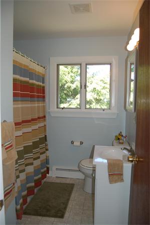 8 Ipswich Road Topsfield, MA 01983 - Photo 14 of 14 a bathroom with a sink toilet and window