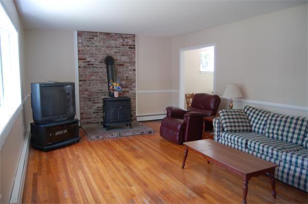 8 Ipswich Road Topsfield, MA 01983 - Photo 3 of 14 a living room with furniture and a fireplace