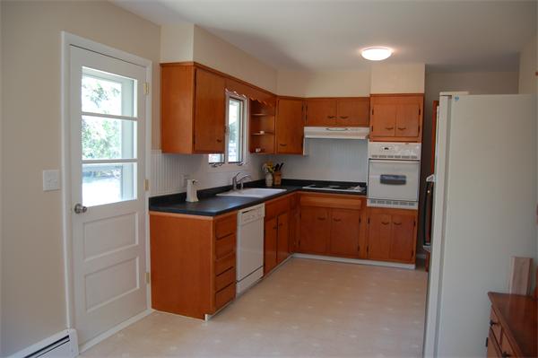 8 Ipswich Road Topsfield, MA 01983 - Photo 5 of 14 a kitchen with stainless steel appliances granite countertop a refrigerator and a stove