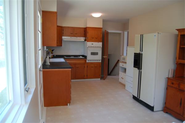 8 Ipswich Road Topsfield, MA 01983 - Photo 6 of 14 a kitchen with stainless steel appliances a refrigerator and a stove