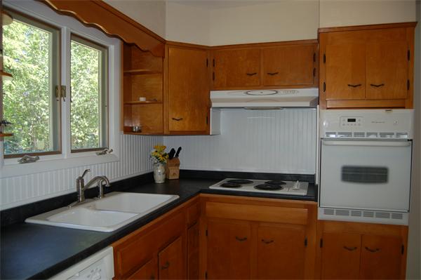 8 Ipswich Road Topsfield, MA 01983 - Photo 7 of 14 a kitchen with stainless steel appliances granite countertop a sink stove and cabinets