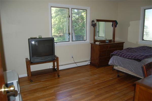 8 Ipswich Road Topsfield, MA 01983 - Photo 10 of 14 a living room with a bed furniture and a window