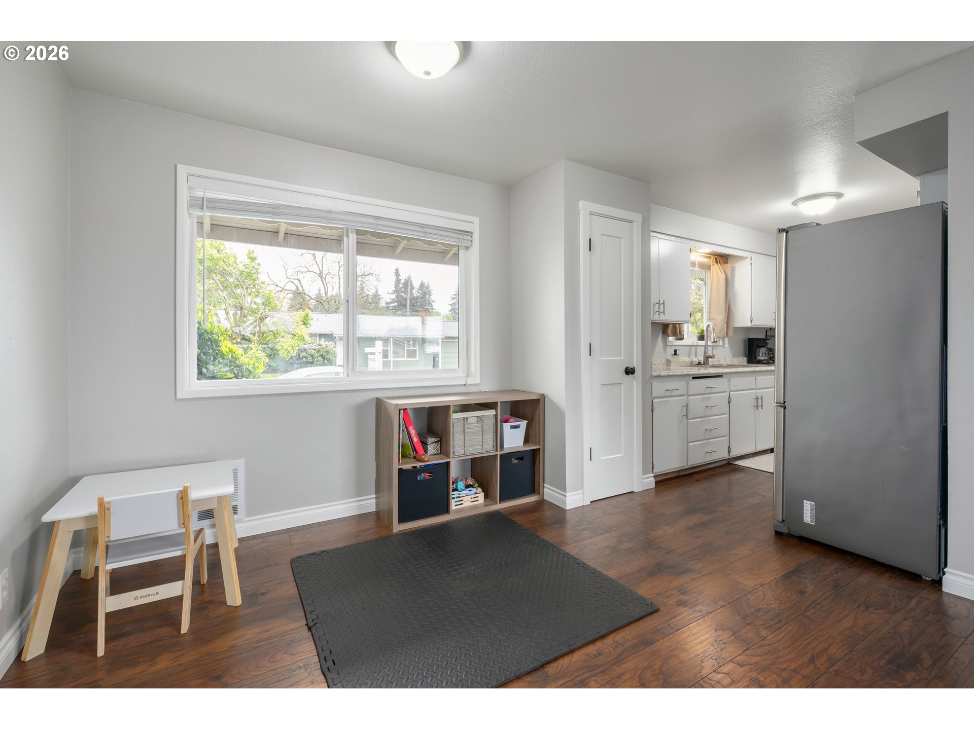 2463 Moore Street Eugene, OR 97404 - Photo 12 of 34 a open kitchen with stainless steel appliances granite countertop a stove and a refrigerator