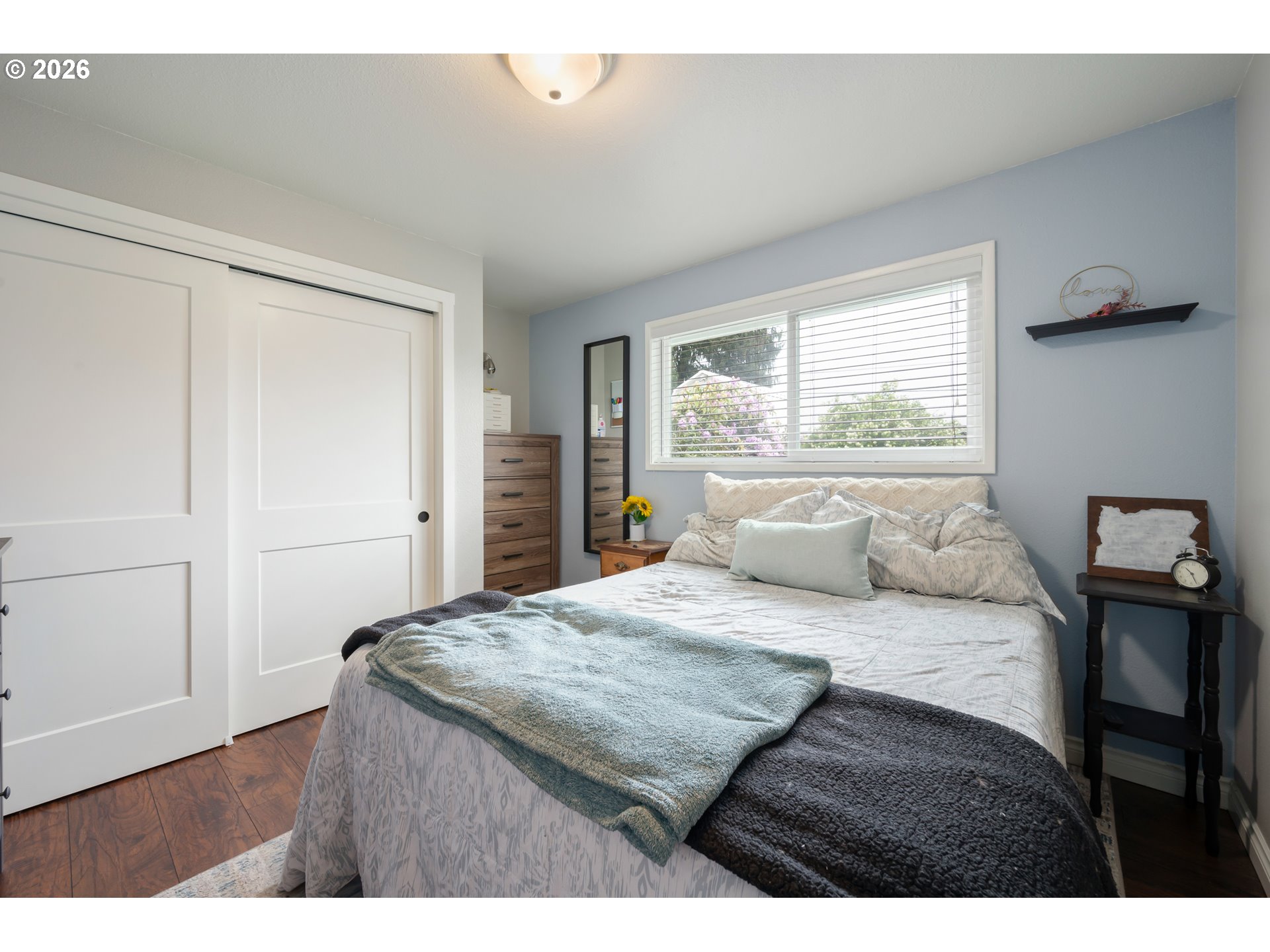 2463 Moore Street Eugene, OR 97404 - Photo 19 of 34 a bedroom with a bed and a table in it