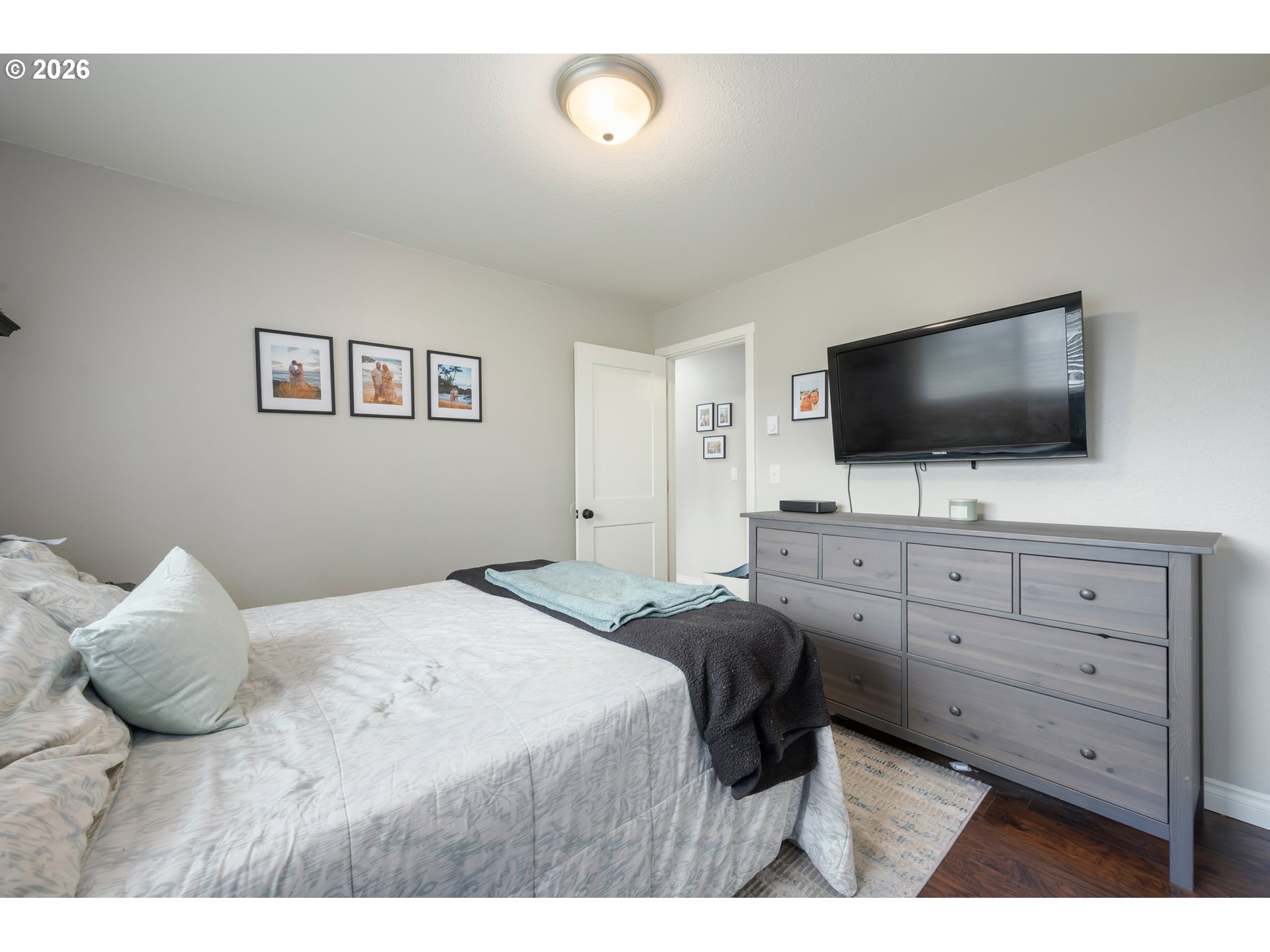 2463 Moore Street Eugene, OR 97404 - Photo 20 of 34 a bedroom with a bed and a flat screen tv